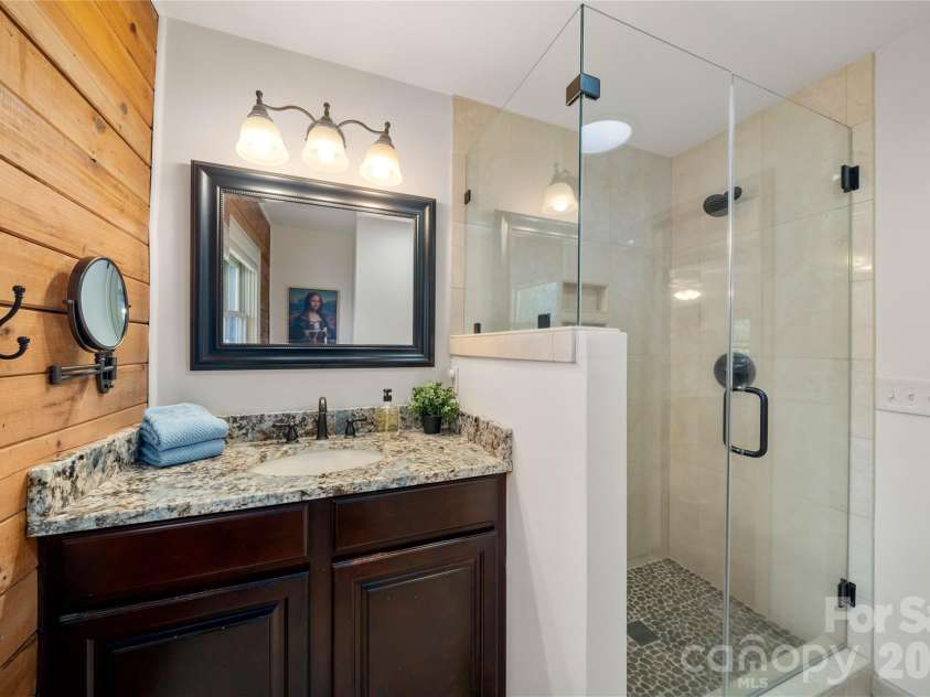37 Cherokee Trail, Fletcher, NC 28732.  MLS# CAR4357676, YatesRealty ID 9928. Main level full bath, granite vanity, walk in shower