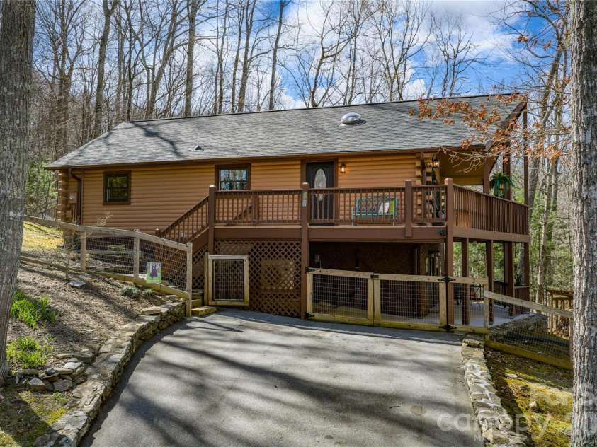 37 Cherokee Trail, Fletcher, NC 28732.  MLS# CAR4357676, YatesRealty ID 9928. Wrap around deck and fenced for pets