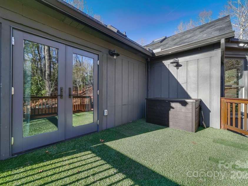 51 Gagama Court, Brevard, NC 28712.  MLS# CAR4225198, YatesRealty ID 9929. Private porch off of the primary bedroom