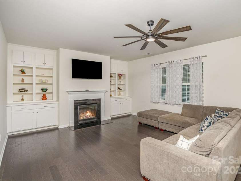 1004 Whipcord Drive, Waxhaw, NC 28173.  MLS# CAR4235846, YatesRealty ID 9930. Living Room with built ins and fireplace