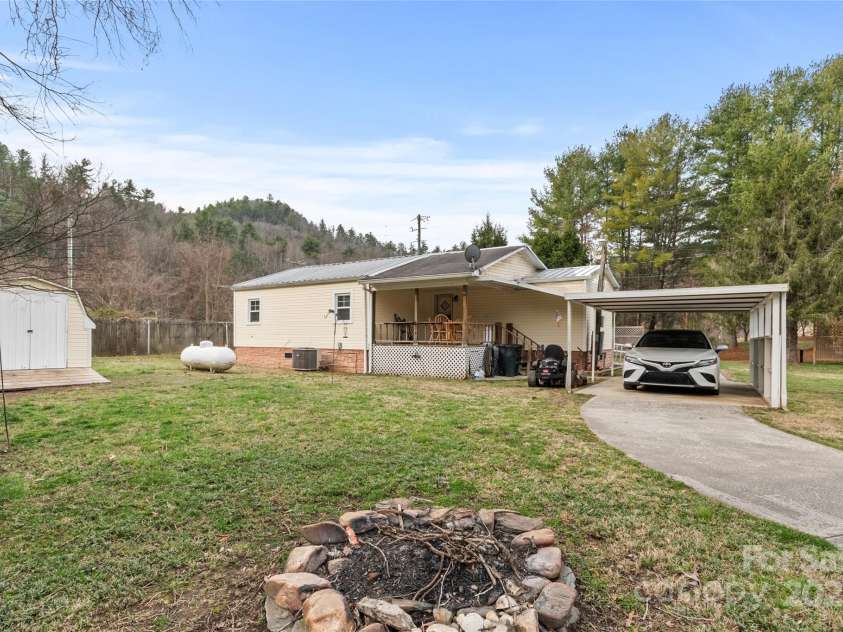 491 Lance Avenue, Hot Springs, NC 28743.  MLS# CAR4235506, YatesRealty ID 9947. Carport with covered walkway to the house offers convenient parking