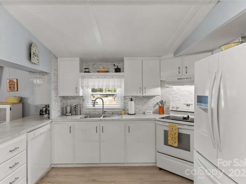 491 Lance Avenue, Hot Springs, NC 28743.  MLS# CAR4235506, YatesRealty ID 9947. Updated kitchen overlooking the front yard