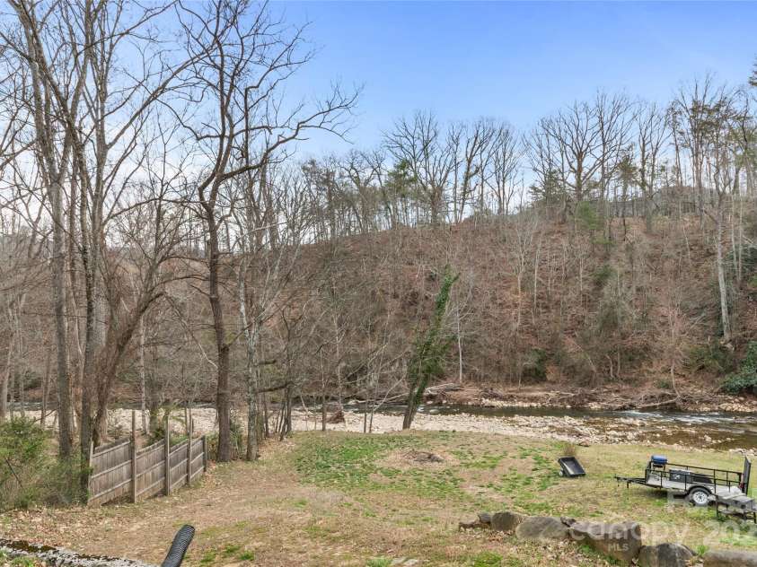 491 Lance Avenue, Hot Springs, NC 28743.  MLS# CAR4235506, YatesRealty ID 9947. View down the hill towards the river