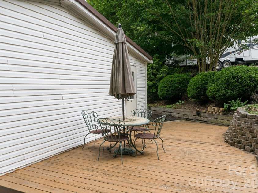 129 Oak Trails Pass, Leicester, NC 28748.  MLS# CAR4329467, YatesRealty ID 9958. Inviting patio