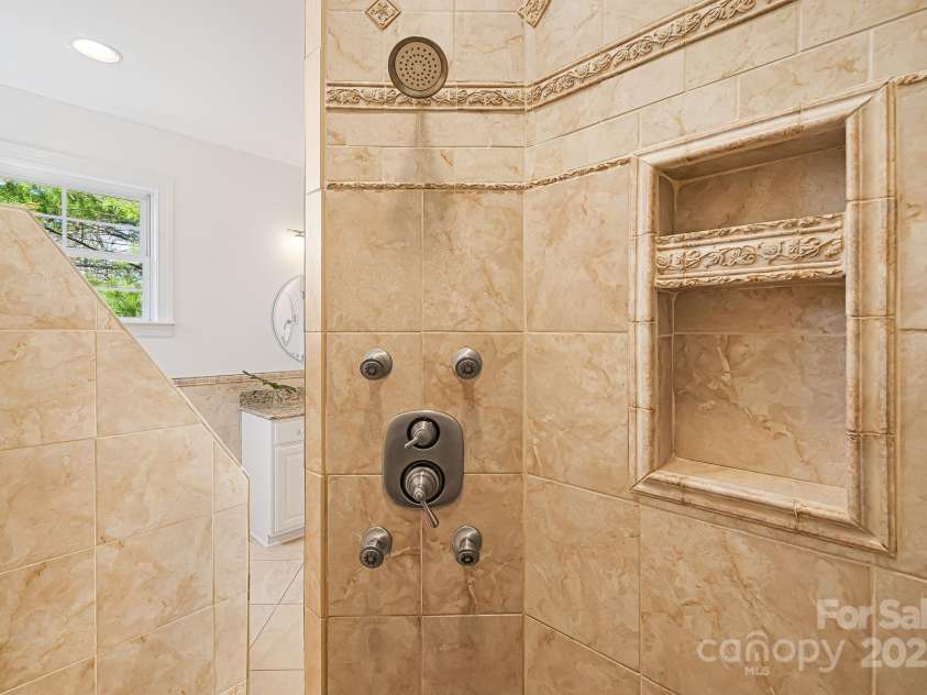 36 White Ash Drive, Asheville, NC 28803.  MLS# CAR4239154, YatesRealty ID 9961. Primary Bathroom Shower (Main Level)