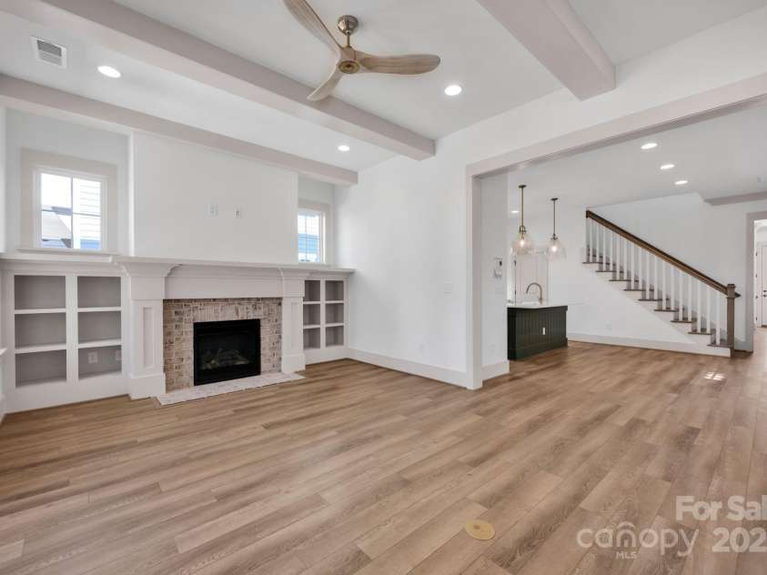 718 Barrel Alley, Fort Mill, SC 29715.  MLS# CAR4217978, YatesRealty ID 9964. Family Room with Built Ins and Ceiling Beams