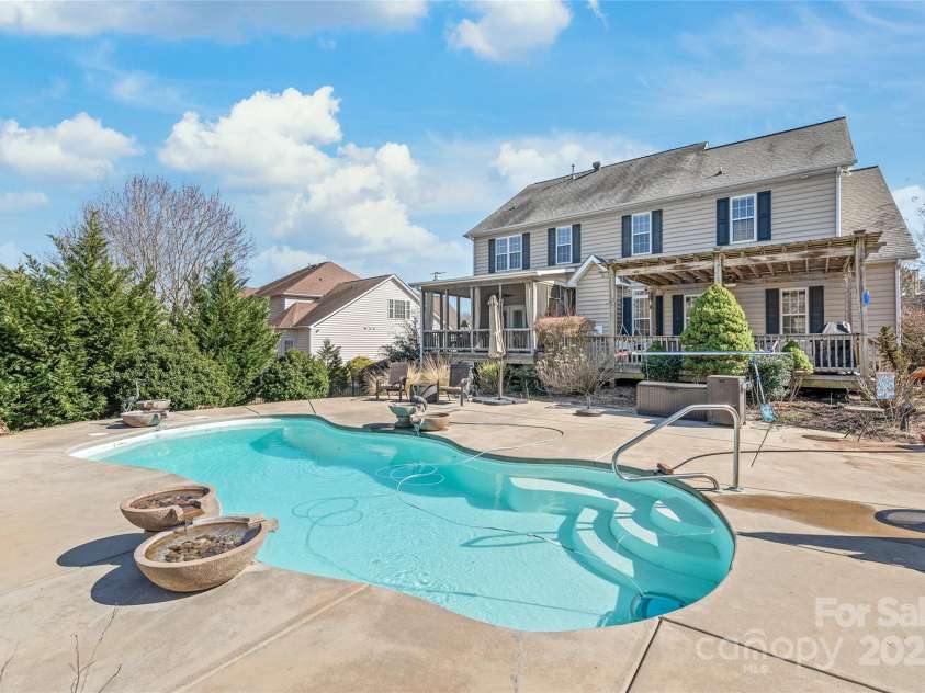 10615 Persimmon Creek Drive, Mint Hill, NC 28227.  MLS# CAR4232856, YatesRealty ID 9969. Stunning Saltwater Pool with Water Features
