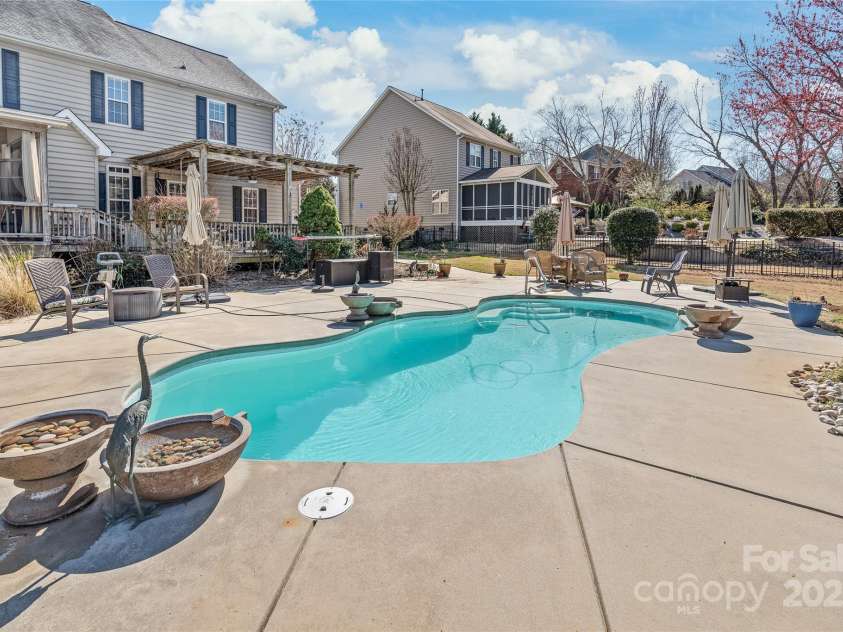 10615 Persimmon Creek Drive, Mint Hill, NC 28227.  MLS# CAR4232856, YatesRealty ID 9969. Stunning Saltwater Pool with Water Features