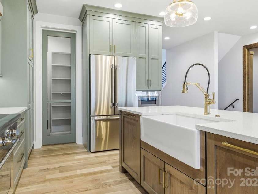 202 Westridge Farm Road, Asheville, NC 28804.  MLS# CAR4312762, YatesRealty ID 997. Expansive walk-in pantry with custom shelving