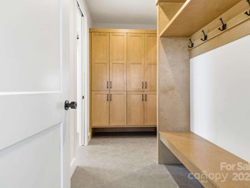 202 Westridge Farm Road, Asheville, NC 28804.  MLS# CAR4312762, YatesRealty ID 997. Spacious mudroom off the garage with abundant storage—an ideal landing zone after a busy day