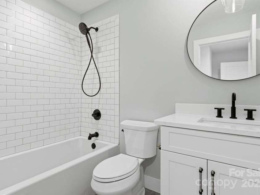 202 Westridge Farm Road, Asheville, NC 28804.  MLS# CAR4312762, YatesRealty ID 997. Well-appointed guest bath with modern finishes and thoughtful design