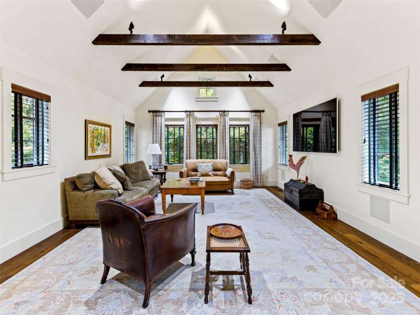 616 Old Growth Forest Road, Burnsville, NC 28714.  MLS# CAR4076276, YatesRealty ID 997. Additionally, you may enjoy this Family Media Room topped by an eye-catching cathedral ceiling