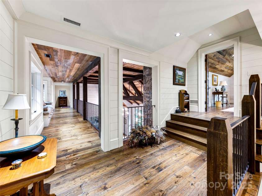 616 Old Growth Forest Road, Burnsville, NC 28714.  MLS# CAR4076276, YatesRealty ID 997. This landing leads either to the catwalk to the other wing, or if you take the 3 stairs up on the right - you'll enter...
