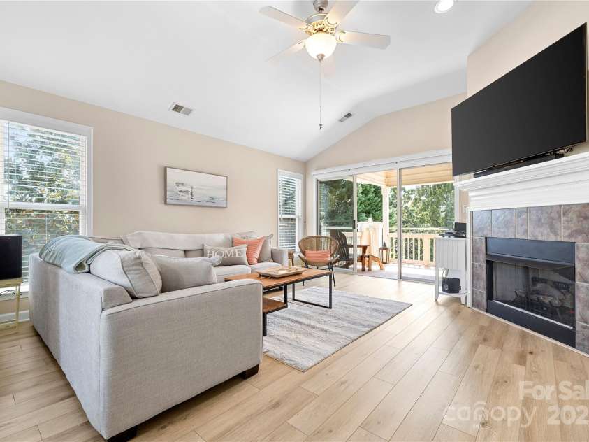 7844 Village Harbor Drive, Cornelius, NC 28031.  MLS# CAR4240892, YatesRealty ID 9972. Cozy up by the gas fireplace—no wood, no mess, just instant comfort at the flip of a switch!