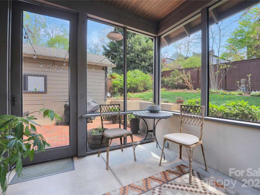 15 Warwick Road, Asheville, NC 28803.  MLS# CAR4249435, YatesRealty ID 9975. Screen Porch off kitchen
