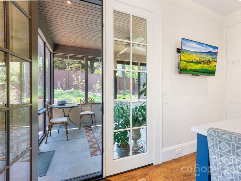 15 Warwick Road, Asheville, NC 28803.  MLS# CAR4249435, YatesRealty ID 9975. Screen Porch off kitchen