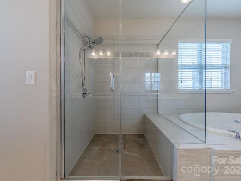 5250 Meadowcroft Way, Fort Mill, SC 29708.  MLS# CAR4251880, YatesRealty ID 9976. Glass Enclosed Tile Shower
