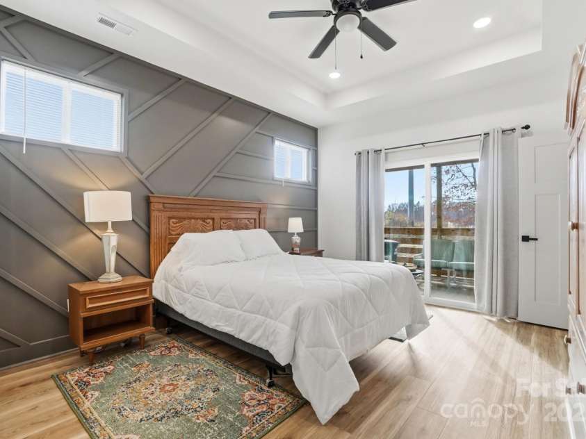 494 22nd Street, Kannapolis, NC 28083.  MLS# CAR4325150, YatesRealty ID 998. Primary Bedroom with sliding glass door to the screen porch