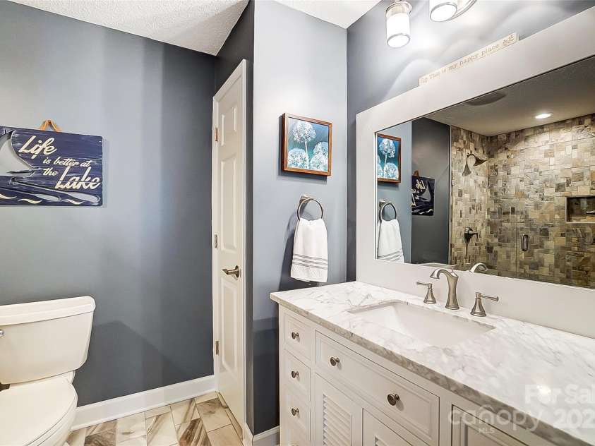 703 Southwest Drive, Davidson, NC 28036.  MLS# CAR4208692, YatesRealty ID 9985. Completely updated primary bathroom