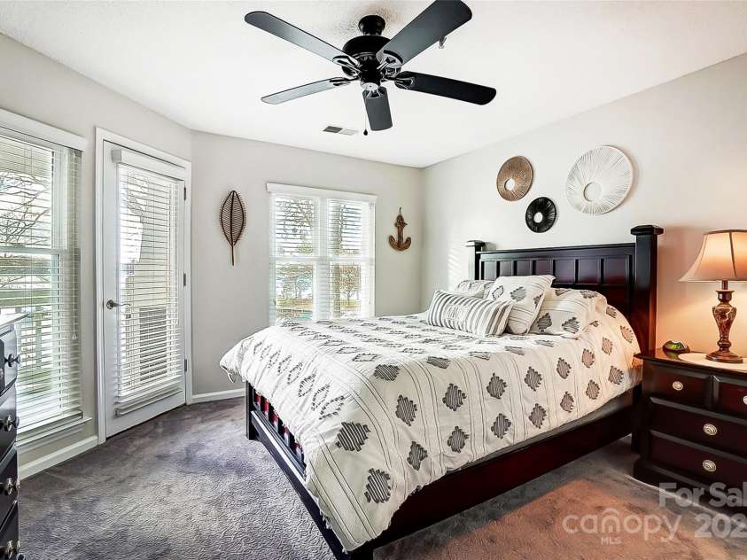 703 Southwest Drive, Davidson, NC 28036.  MLS# CAR4208692, YatesRealty ID 9985. Primary bedroom overlooking Lake Norman
