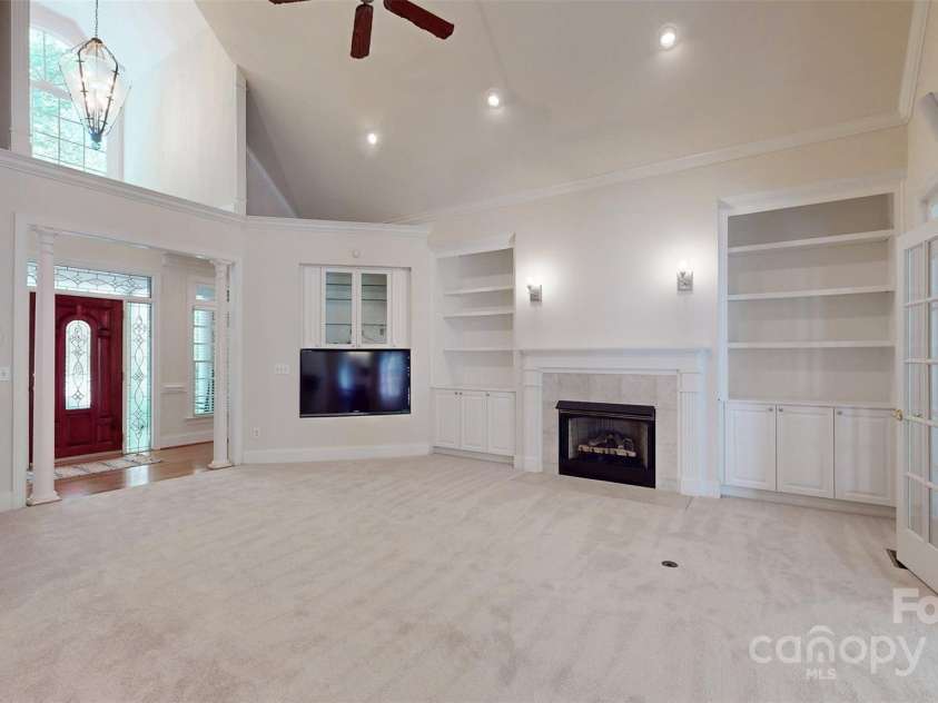 9101 Oak Bluff Court, Marvin, NC 28173.  MLS# CAR4245021, YatesRealty ID 9989. Built in shelving plus fireplace