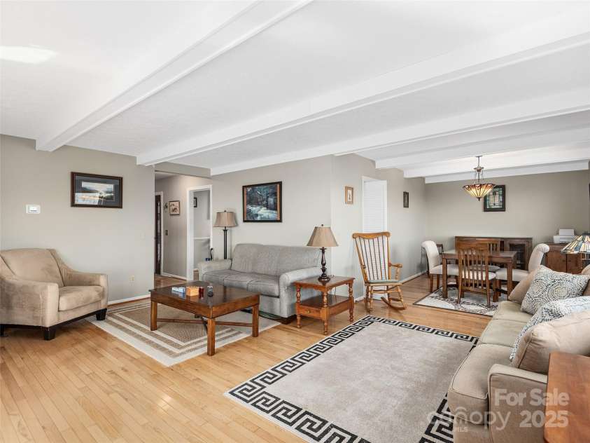 516 Davis Mountain Road, Hendersonville, NC 28739.  MLS# CAR4221083, YatesRealty ID 999. Living room looking into dining area