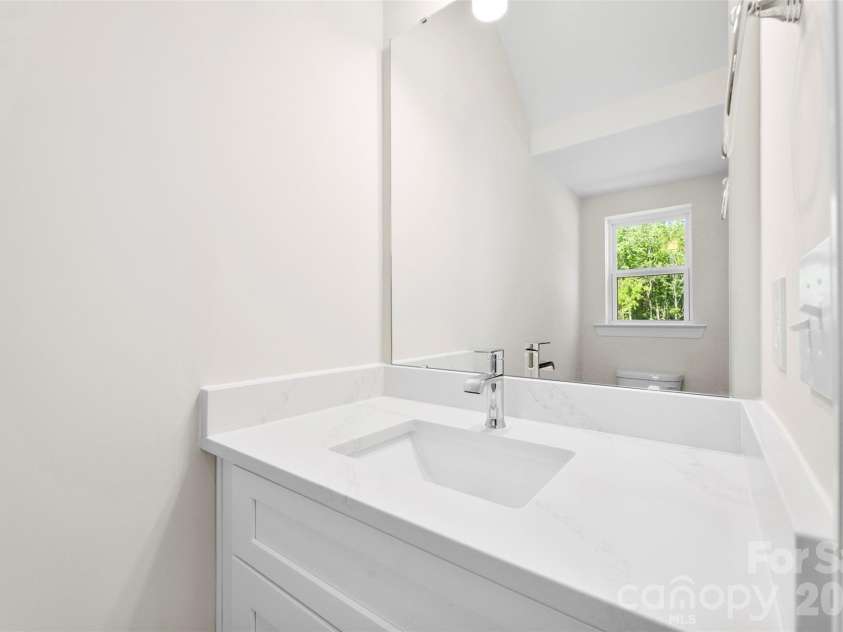 109 Titleist Drive, Statesville, NC 28677.  MLS# CAR4382087, YatesRealty ID 9990. Downstairs Powder bath