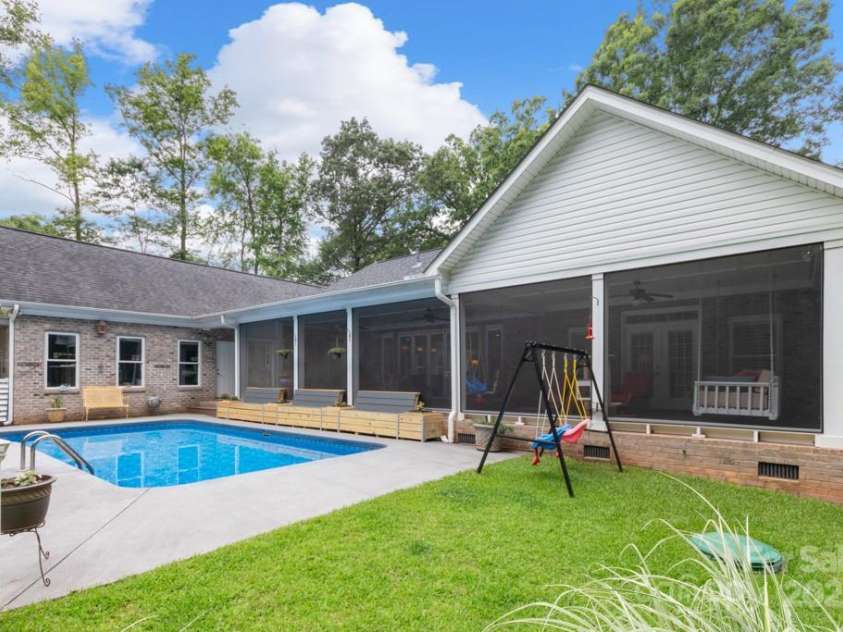 206 Oxford Place Drive, Fort Mill, SC 29715.  MLS# CAR4248553, YatesRealty ID 9999. Incredible screen porch